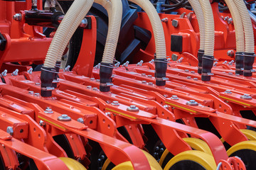 Fragment of a seeder with grain feeding hoses