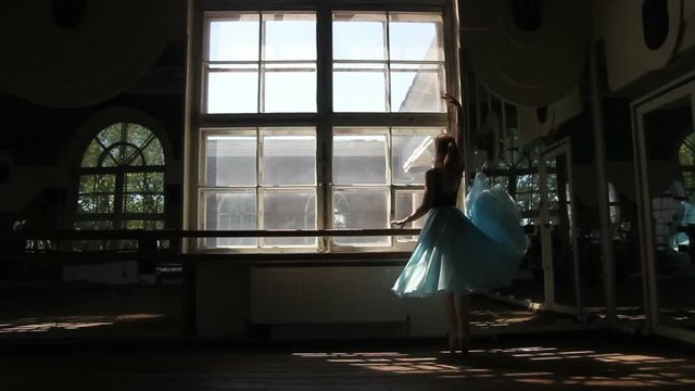 Silhouette of ballet dancer in ballet hall