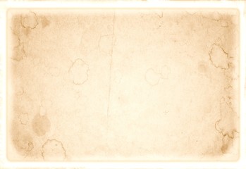 Retro stained paper with faded borders. Useful for texture or background.