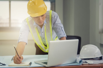 architect man working with laptop and blueprints,engineer inspection in workplace for architectural...