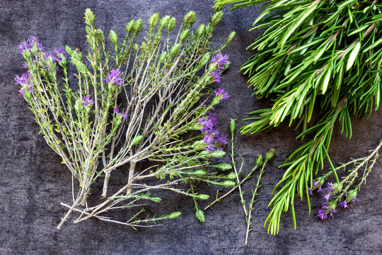 Sprigs of flowering thyme and rosemary.  Spices.