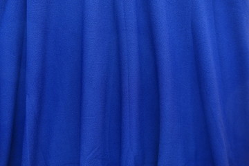Bright electric blue fabric with vertical folds