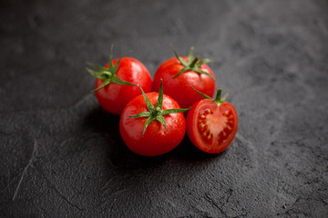 fresh tomato on black background