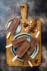 Vegan banana chocolate fudge popsicles with homemade hazelnut spread. Creamy dairy free ice pops, nicecream, fudgesicles