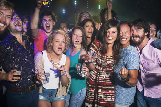 Group of friends celebrating in club