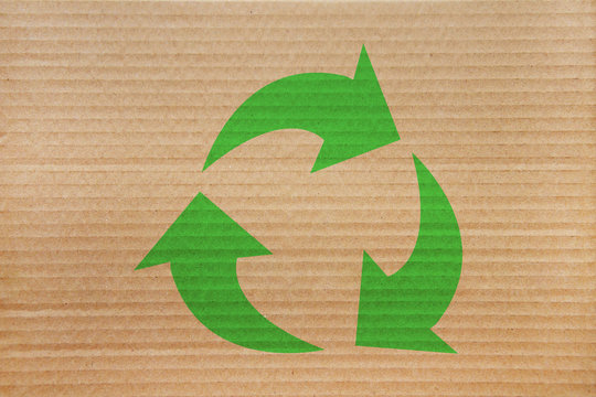 symbol for refuse reuse recycle with cardboard background 