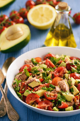Healthy salad with tuna,cherry tomatoes and avocado.
