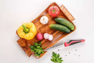 Vegetable salad, vegetarian, pepper, radish, tomato, celery, knife, white background