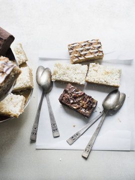 Assortment of brownies and spoons