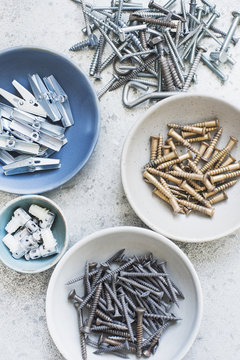Bowls of screws, nails, pegs and hooks