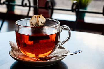 Tea bag put in transparent glass teacup