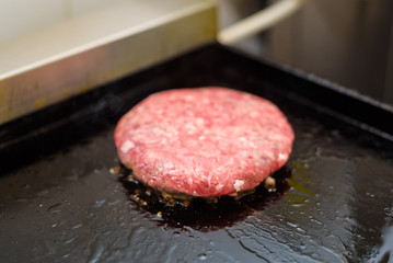 Preparing delicious hamburger patty