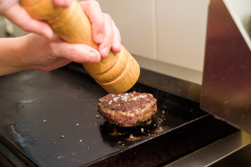 Preparing delicious hamburger patty