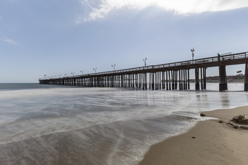 Fototapeta premium Ventura beach and pier with motion blur water in California. 