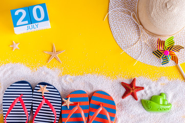 July 20th. Image of july 20 calendar with summer beach accessories and traveler outfit on...