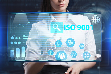 The concept of business, technology, the Internet and the network. A young entrepreneur working on a virtual screen of the future and sees the inscription: ISO 9001