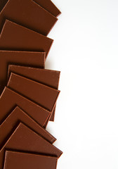 thin pieces of chocolate isolated on white