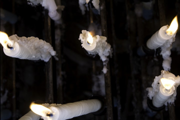 Overhead view of candles lit in chapel of Lourdes