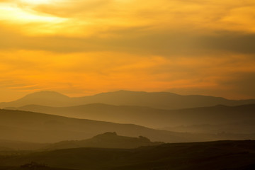 Dawn fog in a rolling landscape