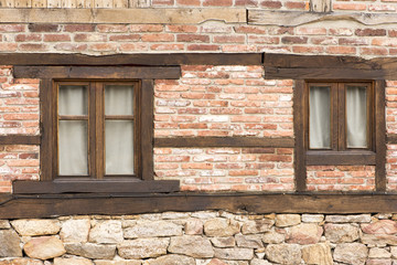 Two windows in an old stone house