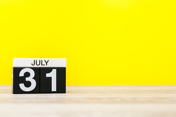 July 31th. Image of july 31, calendar on yellow background. Summer time. With empty space for text