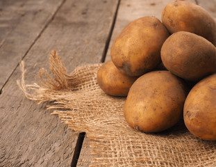 Rich harvest, organic potatoes on a rustic table