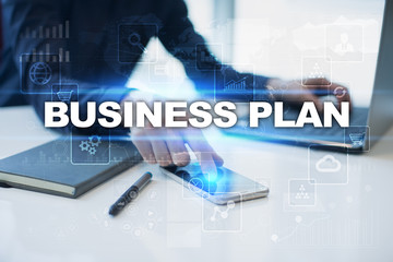 Businessman working in office, pressing button on virtual screen and selecting business plan.