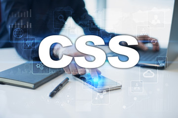 Businessman working in office, pressing button on virtual screen and selecting css.