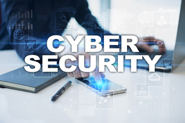 Businessman working in office, pressing button on virtual screen and selecting cyber security.