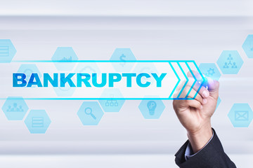 Businessman drawing on virtual screen. bankruptcy concept.