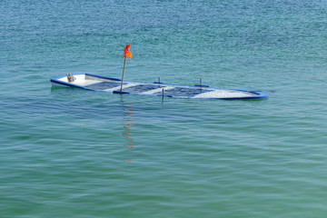 wooden fishing boat submerged in water