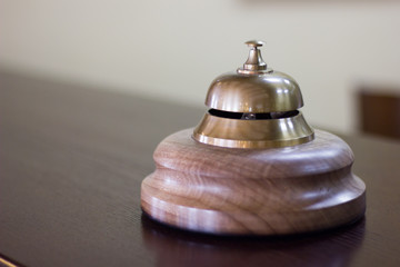 Service bell in a hotel reception for concierge alarm on desk.