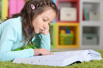 Little girl  reading book