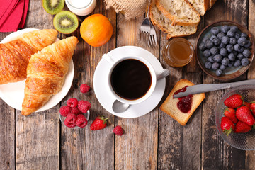 breakfast with coffee,croissant and fruits