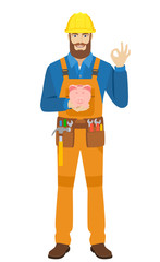 Worker with piggy bank showing a okay hand sign