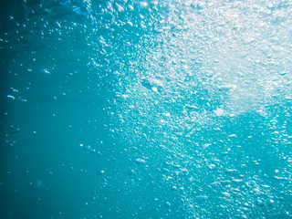 Bubbles underwater in sea. Texture in ocean