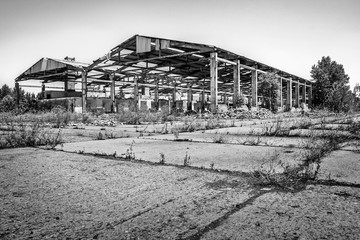 Fototapeta na wymiar Abandoned dilapidated industrial building