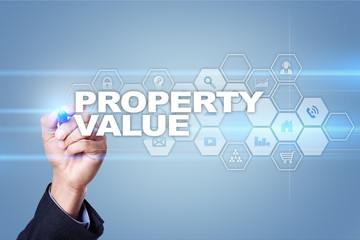 Businessman drawing on virtual screen. property value concept.