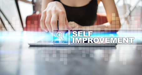 Woman using tablet pc and selecting self improvement.