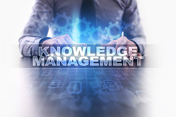 Businessman working with modern tablet pc and selecting knowledge management.