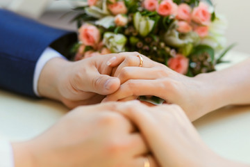 Obraz na płótnie Canvas Close-up of wedding hands with rings