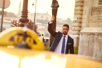 Young businessman with a taxi  