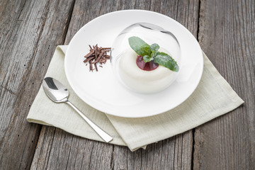 dessert named panacota. With chocolate and jam