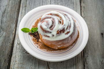 Cinnamon rolls with almond on the table.