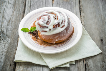 Cinnamon rolls with almond on the table.