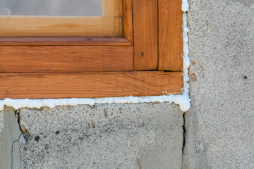 Construction foam. Foam of a stroiteln at a window.