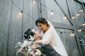 Young marriage couple in rustic style at summer
