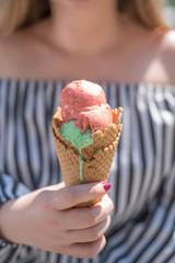 melting ice cream in  hand