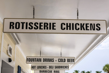 Overhead signs outside Hudson's Grocery store in Boca Grande FL