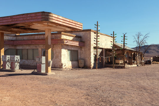 Old gas station in Sahara desert  near Ouarzazate, Morocco. Toned image.
